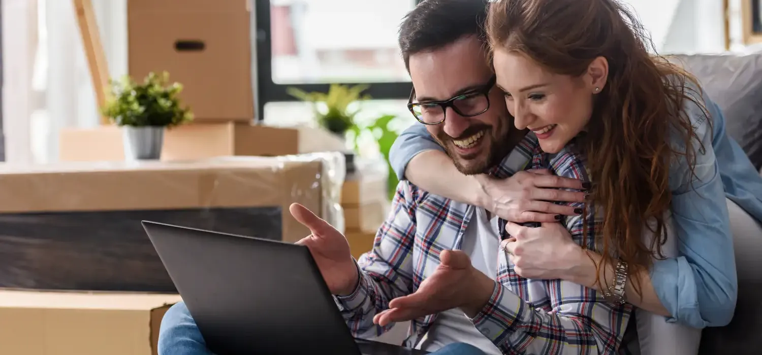 Couple looking the laptop